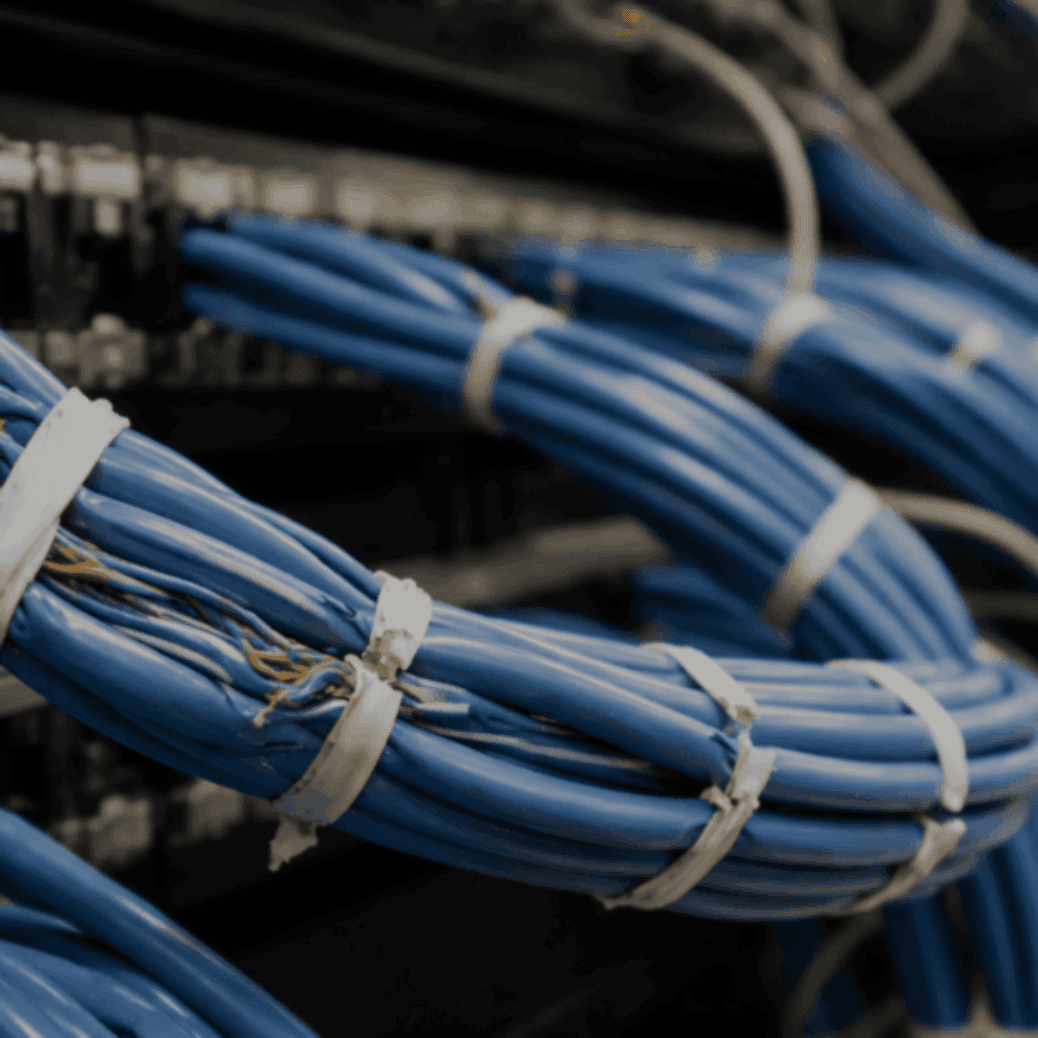 overtightened cable ties damaging a structured cabling system in a business server room